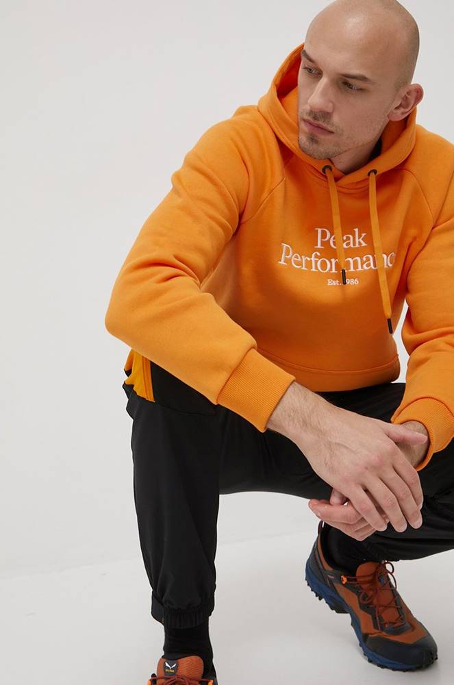 Mikina Peak Performance pánska, oranžová farba, s nášivkou