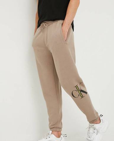 Tepláky Calvin Klein Jeans pánske, béžová farba, s potlačou