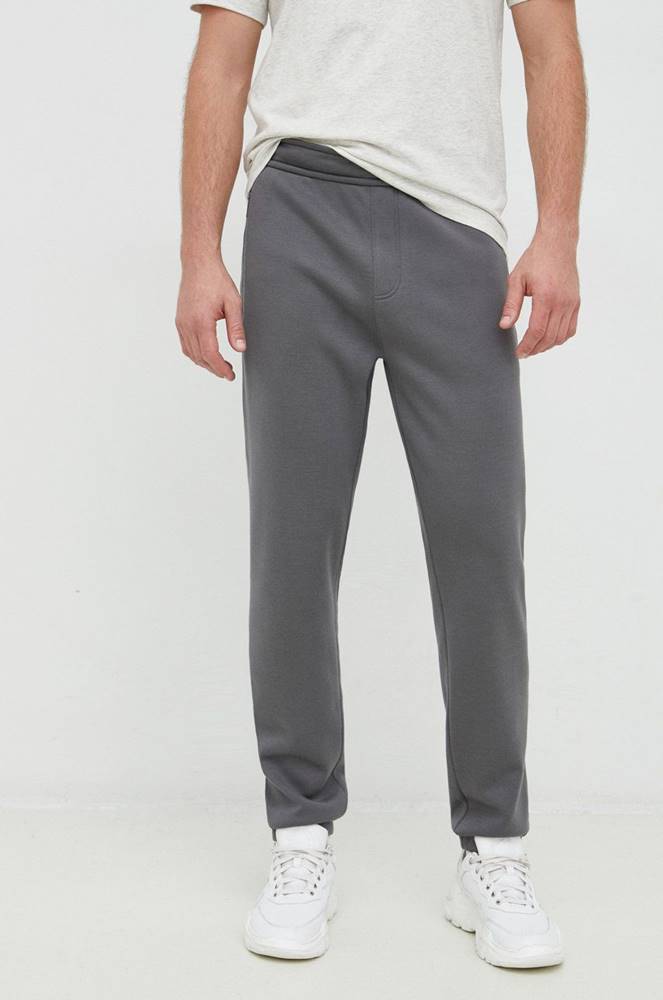 Tepláky Calvin Klein pánske, šedá farba, jednofarebné