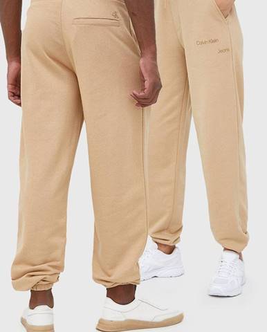 Nohavice Calvin Klein Jeans béžová farba, jednofarebné
